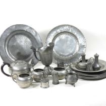 A collection of pewter, to include chargers