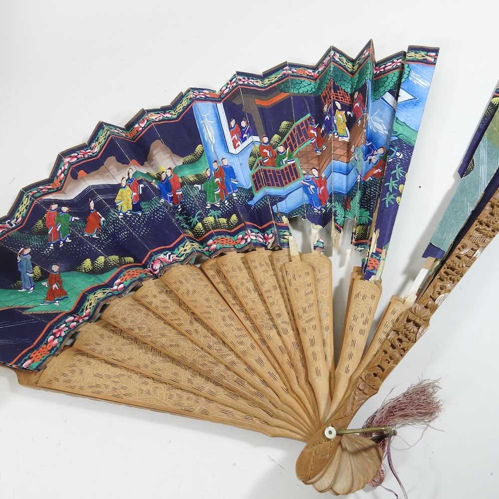 A 19th century Chinese carved wooden fan, decorated with figures, in a lacquered box, together - Image 11 of 12