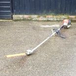 A petrol pole hedge cutter