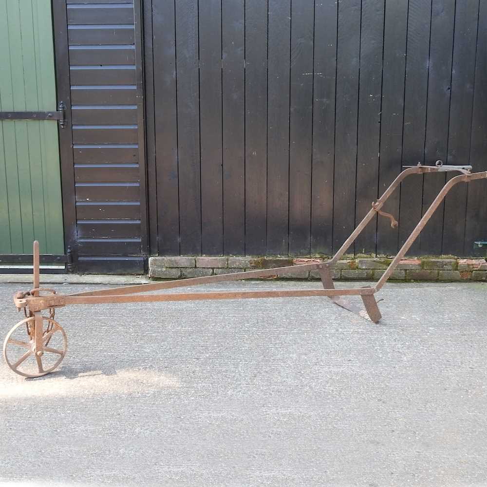 A 19th century iron hand plough, 300cm long