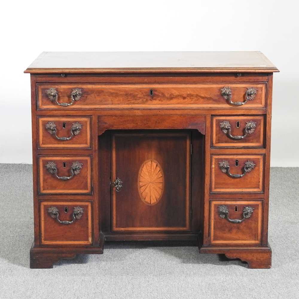 A 19th century mahogany, inlaid and crossbanded kneehole desk, on bracket feet 91w x 53d x 77h cm