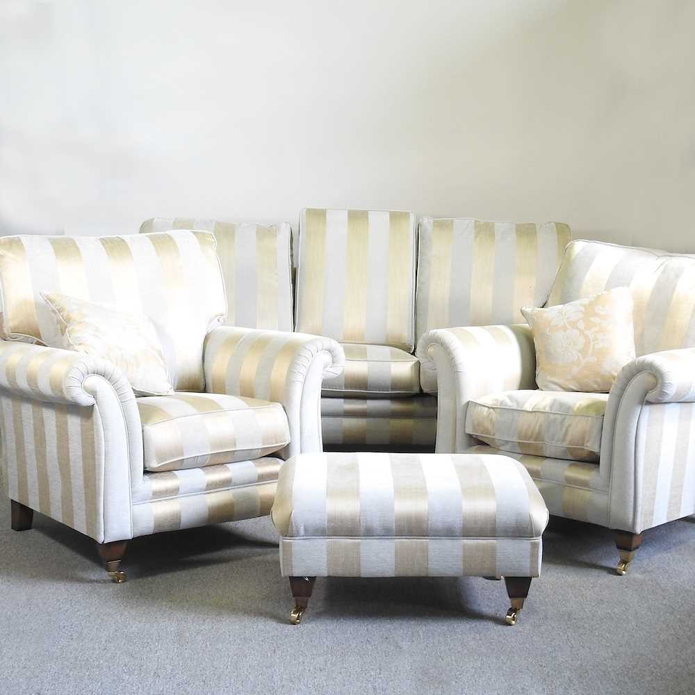 An Alston cream and gold striped two seater sofa, 200cm, together with a pair of matching