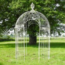 A large white painted wirework garden pergola, of circular shape, with a domed top 200w x 310h cm
