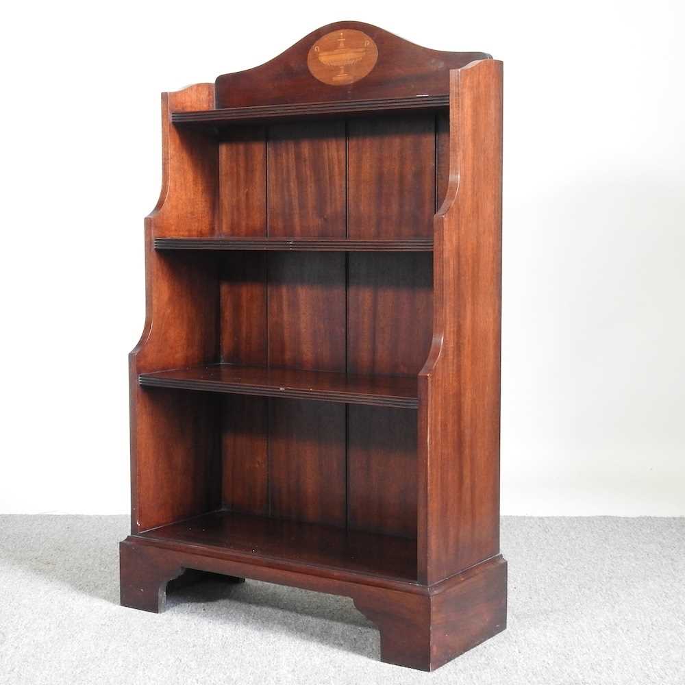 A mahogany and inlaid waterfall bookcase, on bracket feet 64w x 27d x 104h cm