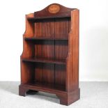 A mahogany and inlaid waterfall bookcase, on bracket feet 64w x 27d x 104h cm