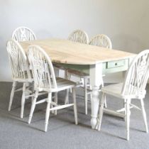 A painted and pine drop leaf dining table, with a natural top, together with a set of six wheel back