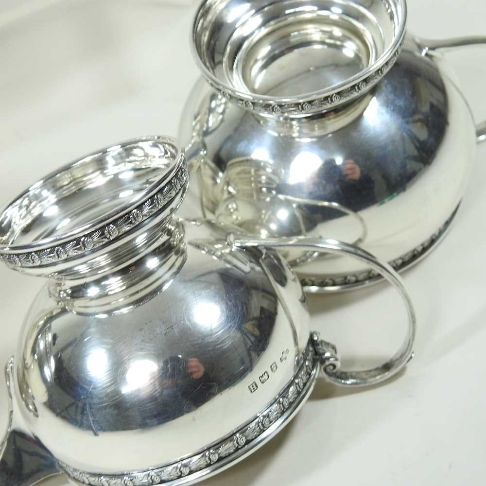 An early 20th century silver four piece tea service, of circular shape, with ebonised handles and - Image 6 of 8