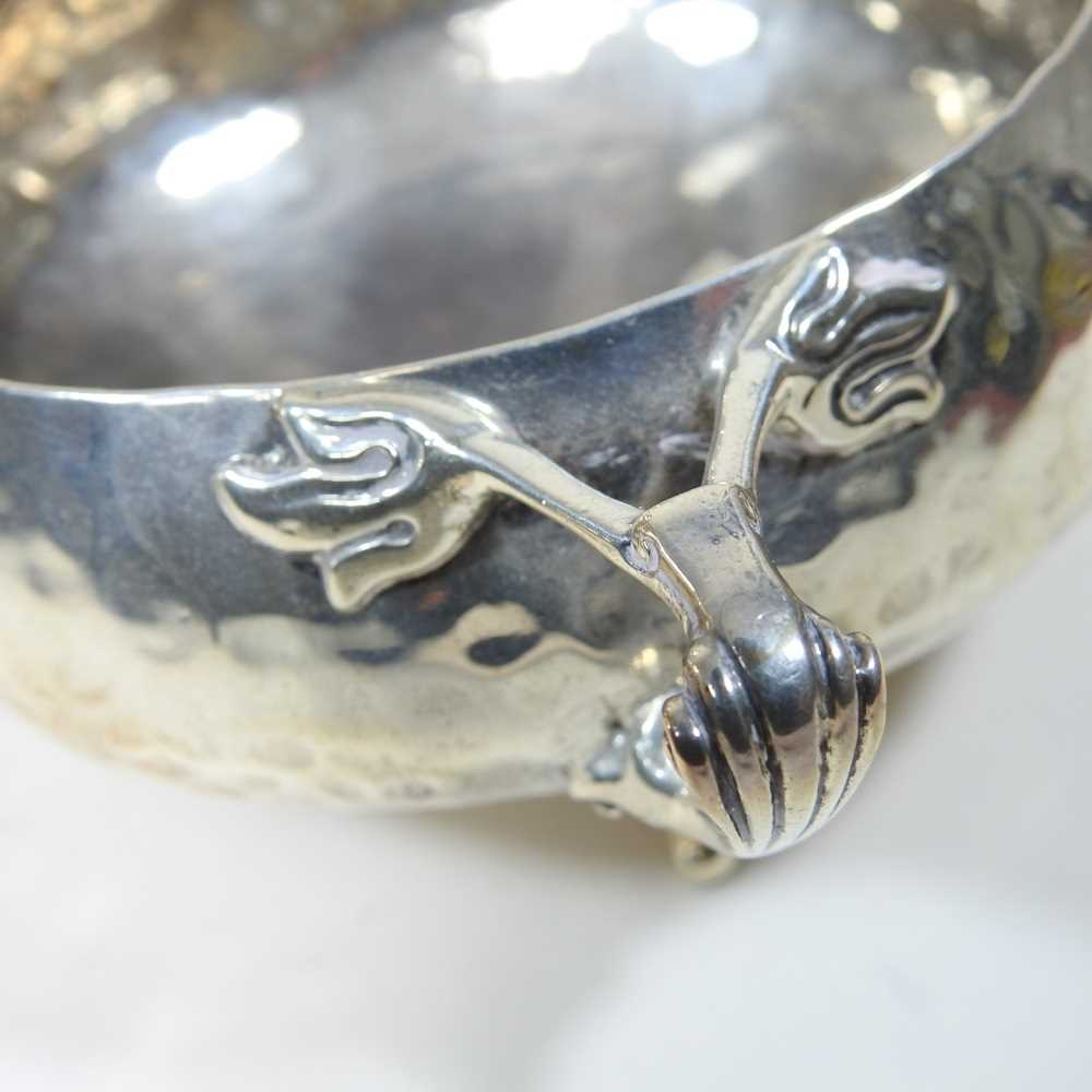 An Edwardian Art Nouveau silver three piece tea service, comprising teapot, 24cm long, sugar bowl - Image 4 of 6