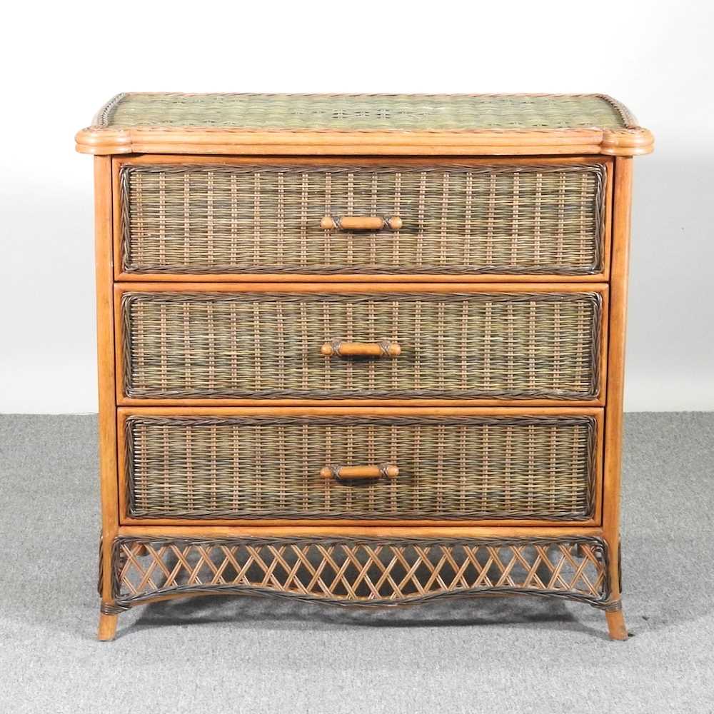 A wicker chest of three drawers 97w x 51d x 91h cm