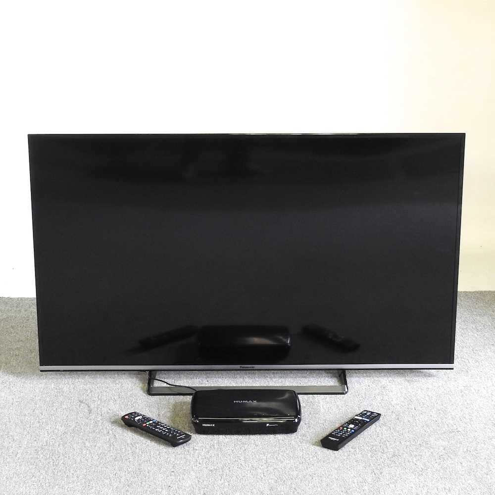 A Panasonic fifty inch LCD television, with remote control and a Humax box
