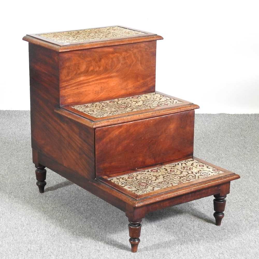 A 19th century mahogany step commode, with a tapestry top 48w x 73d x 55h cm
