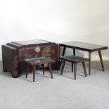 A mid 20th century Eastern carved camphorwood blanket box, together with a matching coffee table and