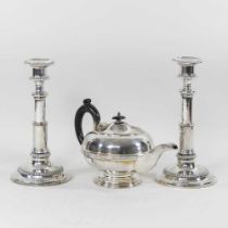 A pair of silver plated table candlesticks and a silver plated teapot (2)
