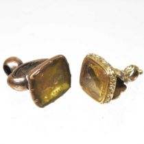 A 19th century citrine seal, carved with a dog, together with another carved with a soldier, 25mm