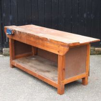 A wooden work bench, fitted with a vice 180w x 67d x 81h cm