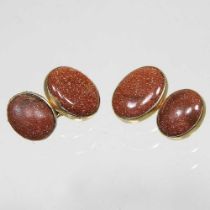 A pair of 18 carat gold and red aventurine cufflinks, of oval shape, 7g, 15 x 11mm