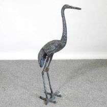 A large metal garden sculpture of a crane, 82cm high Beak is broken