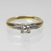 An 18 carat gold and platinum set single stone diamond ring, 2.4g, size M