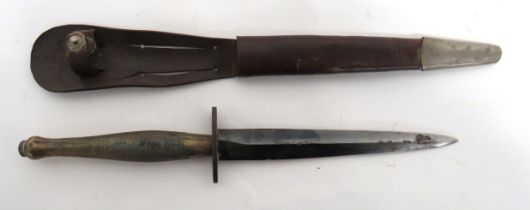 2nd Pattern Fairbairn-Sykes Commando Knife In Early Scabbard 6 1/2 inch, double edged, blued blade.