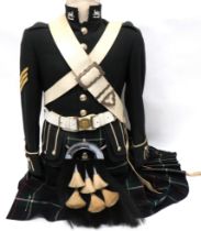 Modern Gordon Highlanders Uniform consisting dark green doublet with high collar.  Gauntlet cuffs