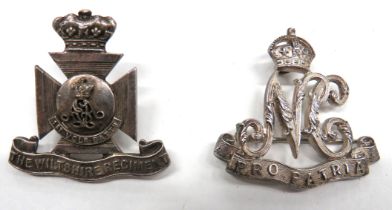 Two Silvered Cap Badges consisting silver hallmarked by "H & S", KC Natal Carabiniers ... Unmarked