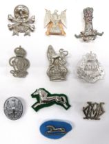 10 x Cavalry Arm Badges consisting silvered 11th Hussars (lugs) ... White metal 17/21 Lancers (lugs)