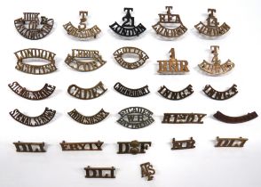 27 x British Brass Shoulder Titles including T.14 London ... Leeds. W. York (1 lug absent) ... T4