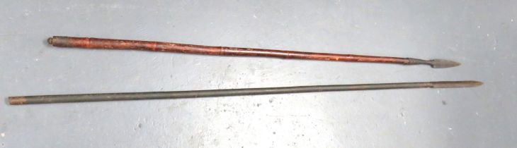 Two 19th Century Spears consisting an Indian example.  11 1/2 inch, double edged blade brazed into a
