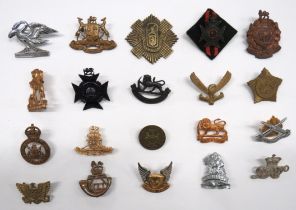 20 x African Cap Badges including blackened QC Royal Rhodesia Reg with backing felt ... Brass