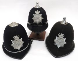 Three Various Post 1953 Constabulary Helmets consisting black crowns.  One with plated top rose