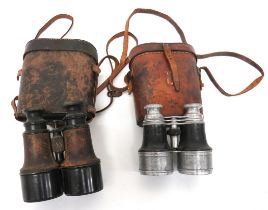 Two Pairs Of WW1 Period Field Binoculars consisting pair of blackened brass, field binoculars.
