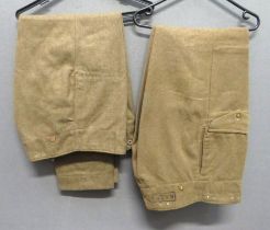 Two Pairs Of 1946 Pattern Battledress Trousers consisting khaki, woollen, wide leg trousers.