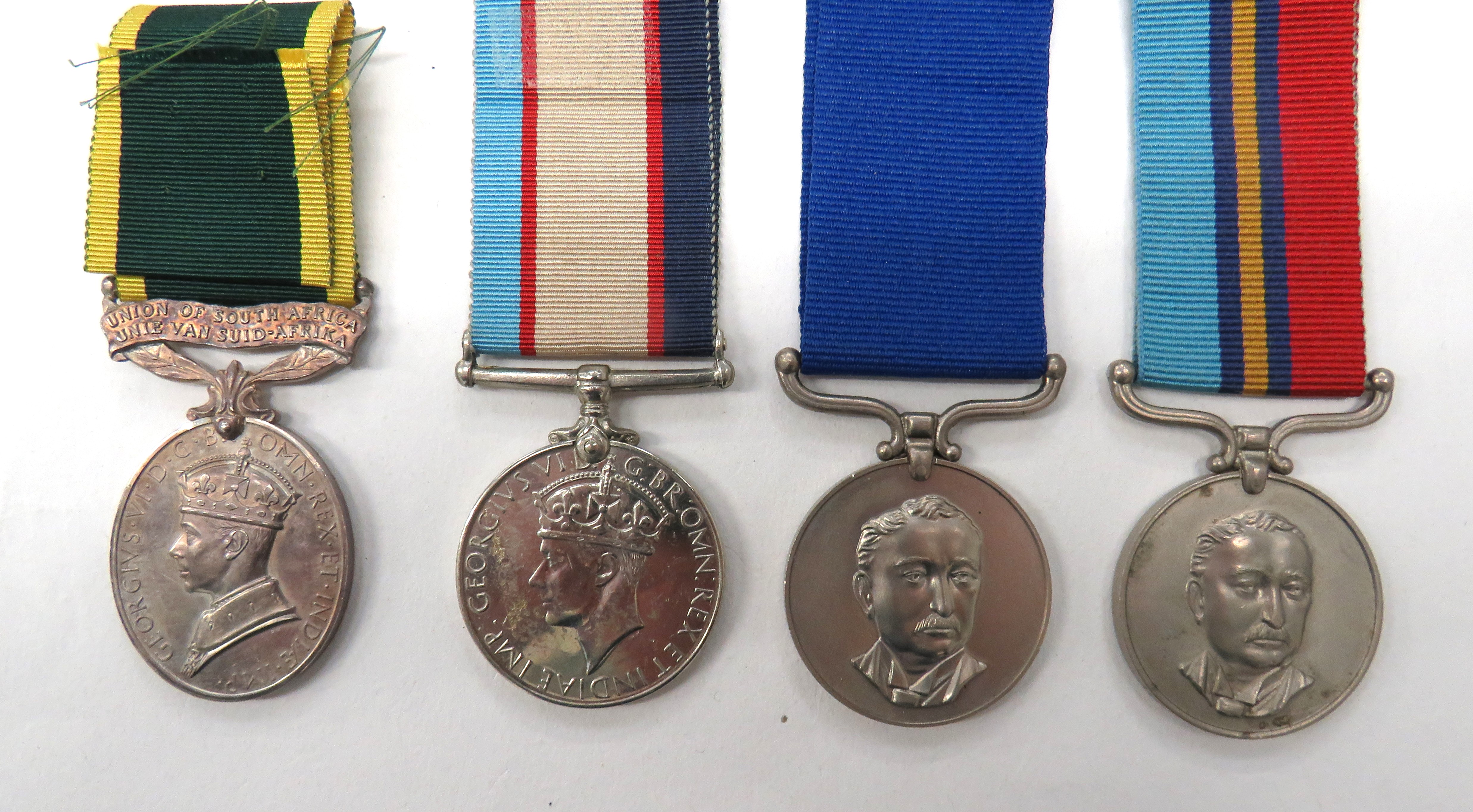 Four Various Commonwealth/Overseas Medals consisting GRVI Union Of South Africa Efficiency medal.