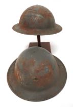 Two WW2 Civil Defence Home Front Factory Helmets grey painted crowns.  The front with small, oval,