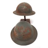 Two WW2 Civil Defence Home Front Factory Helmets grey painted crowns.  The front with small, oval,