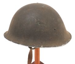 British MKIII Turtle Pattern Steel Helmet brown painted, rough texture shell.  High side rivets