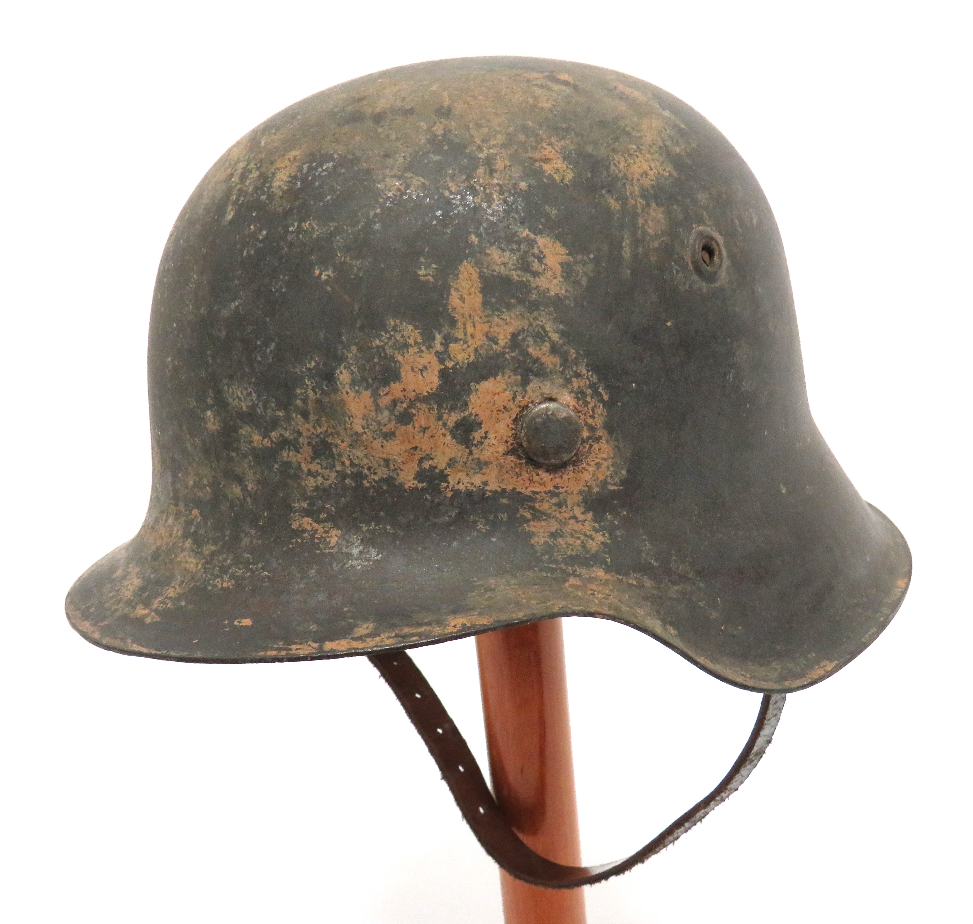 German M1942 Raw Edge Steel Helmet steel crown with lower raw edge brim.  Traces of green paint