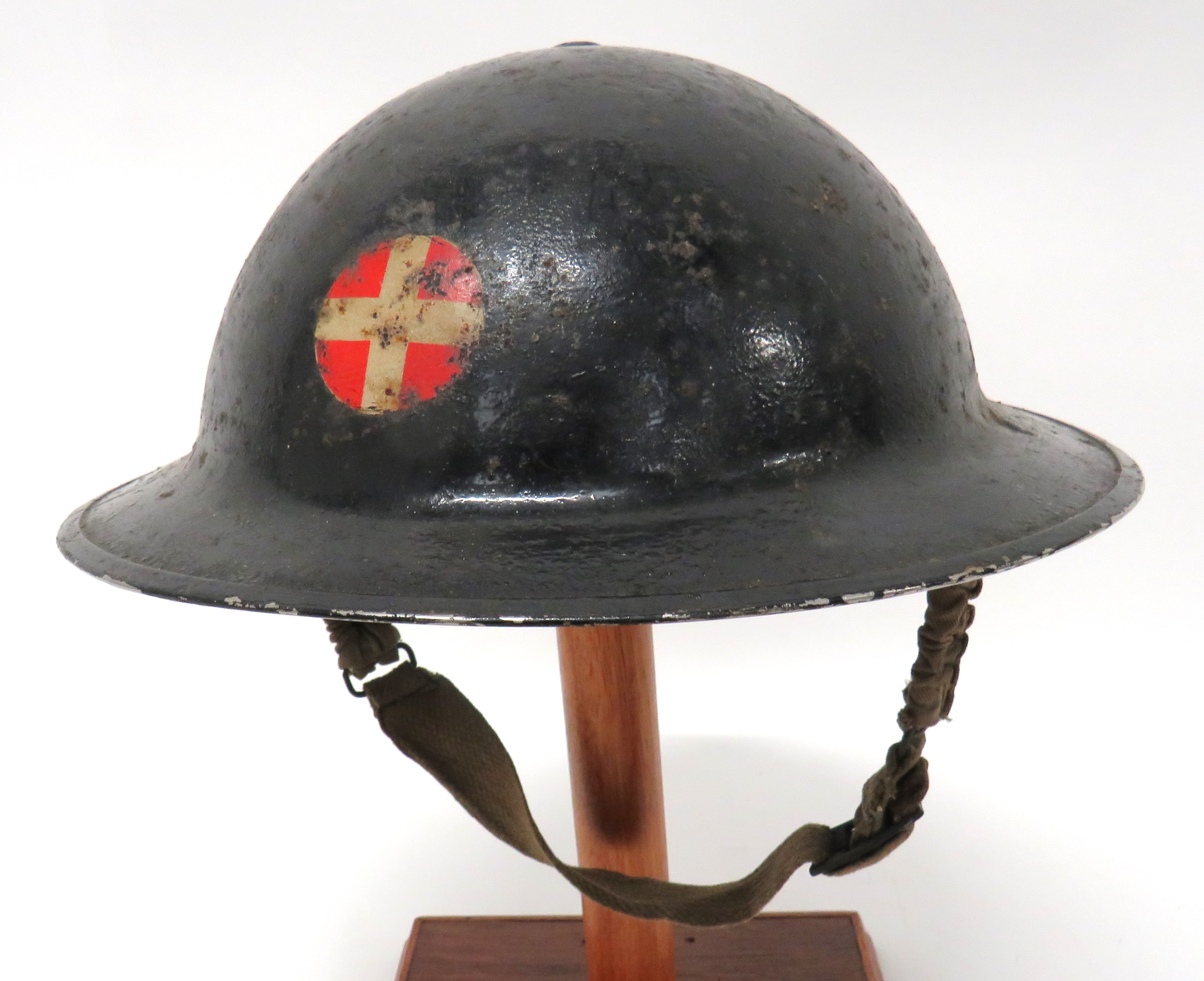 WW2 Home Front Medical Service Helmet black painted shell.  The front with transfer red circle