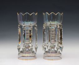 A pair of Victorian glass lustre vases each comprising a cut glass and part gilded bowl with