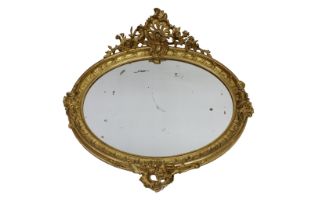 A French, late 19th century, oval gilded Rococo style mirror with original gilding, 38½ x 42in. (