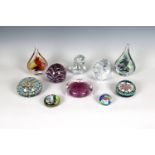 A collection of glass paperweights to include two Poland teardrop paperweights with original