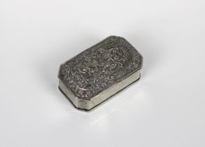 An Indian white metal trinket box of elongated octagonal form, the hinged domed cover embossed