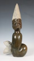 Gotarm Chamu - a carved serpentine sculpture Water Spirit figure, carved with human head and fish