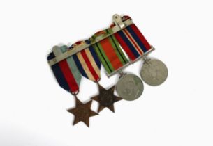 A British WWII military campaign medal group comprising the France and Germany star, 1939-1945 star,