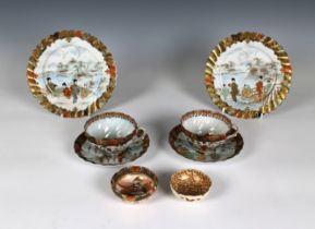 A pair of Japanese Satsuma porcelain scalloped tea cups and saucers together with a pair of Japanese