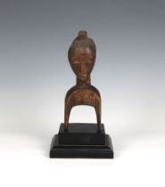 An African tribal bust possibly originally used as a handle, on later two tier plinth, overall