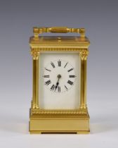 A Grande Sonnerie gilt brass carriage clock with push button repeat, early 20th century, no. 422, in