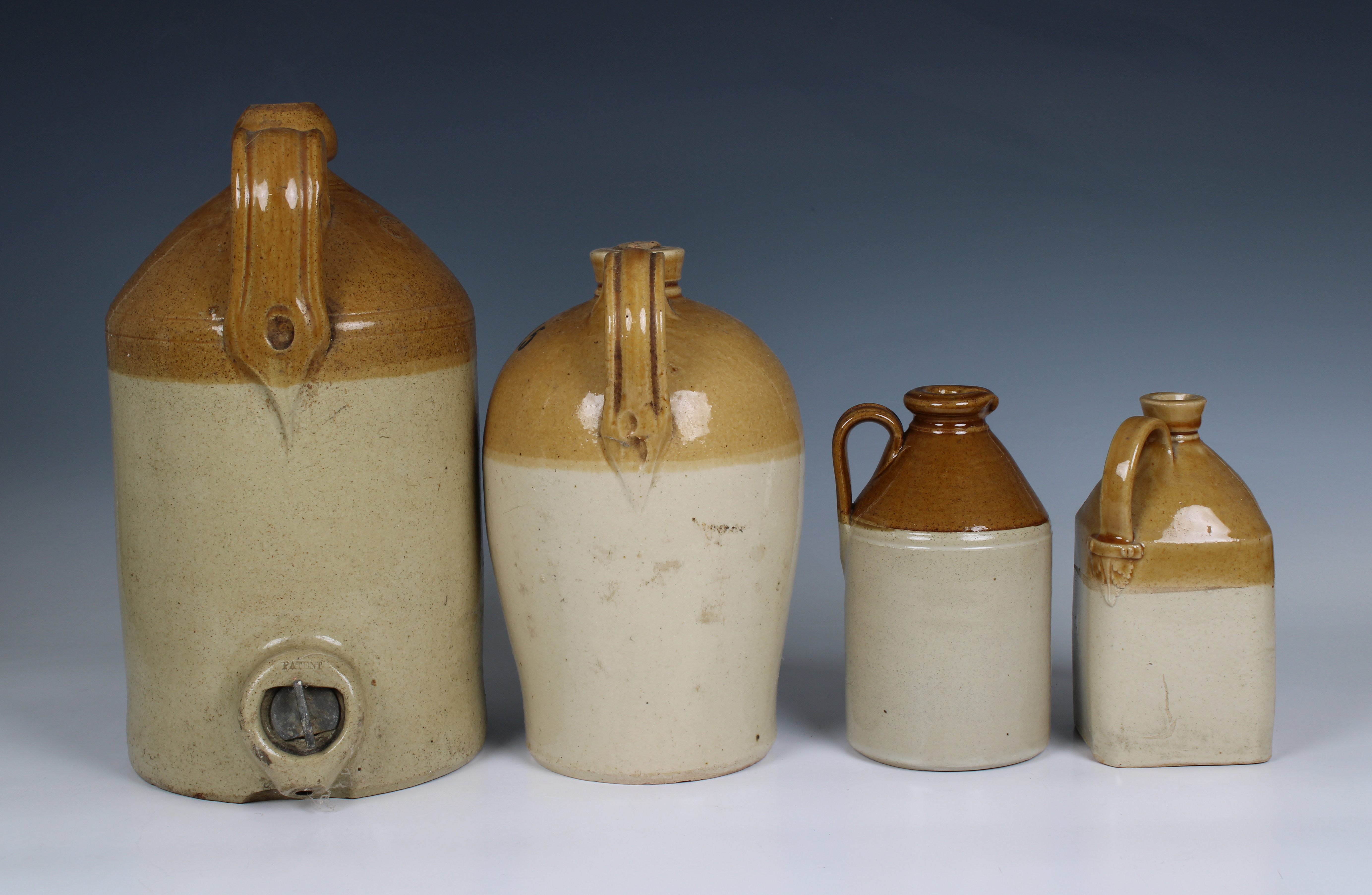 A small collection of stoneware flagons to include a W. J. Armstrong, Wine, Spirit & Beer - Image 2 of 2