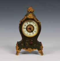 A painted wood and gilt metal French mantel clock 10¾in. (27.4cm.) high.