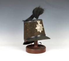An extremely rare 4th (West) Royal Guernsey Militia shako black cloth sides, leather top, black